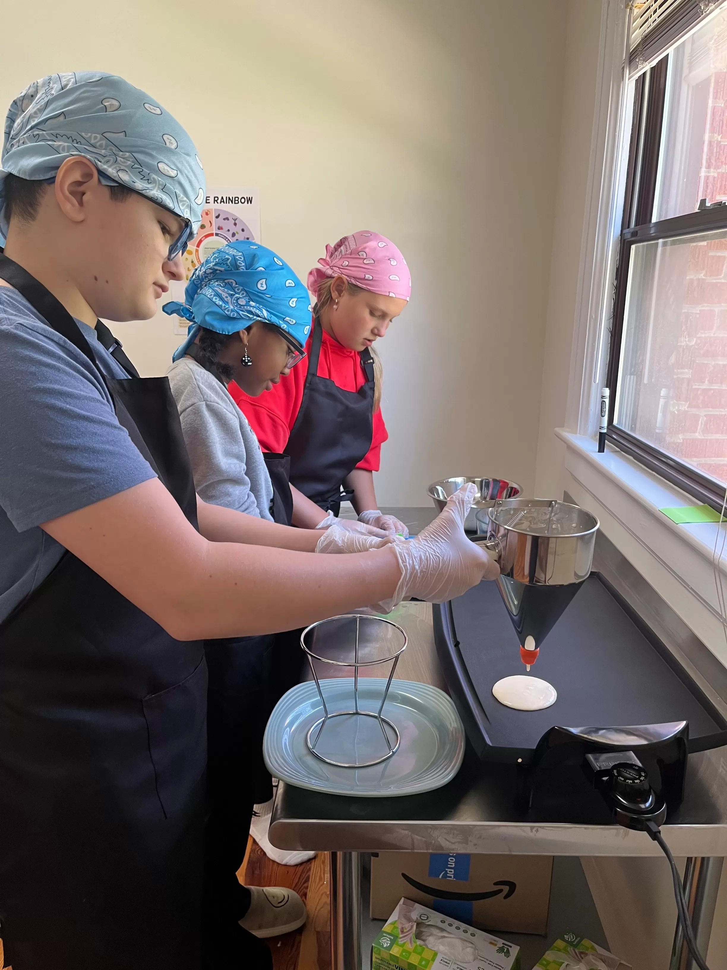 Adolescent students making pancakes