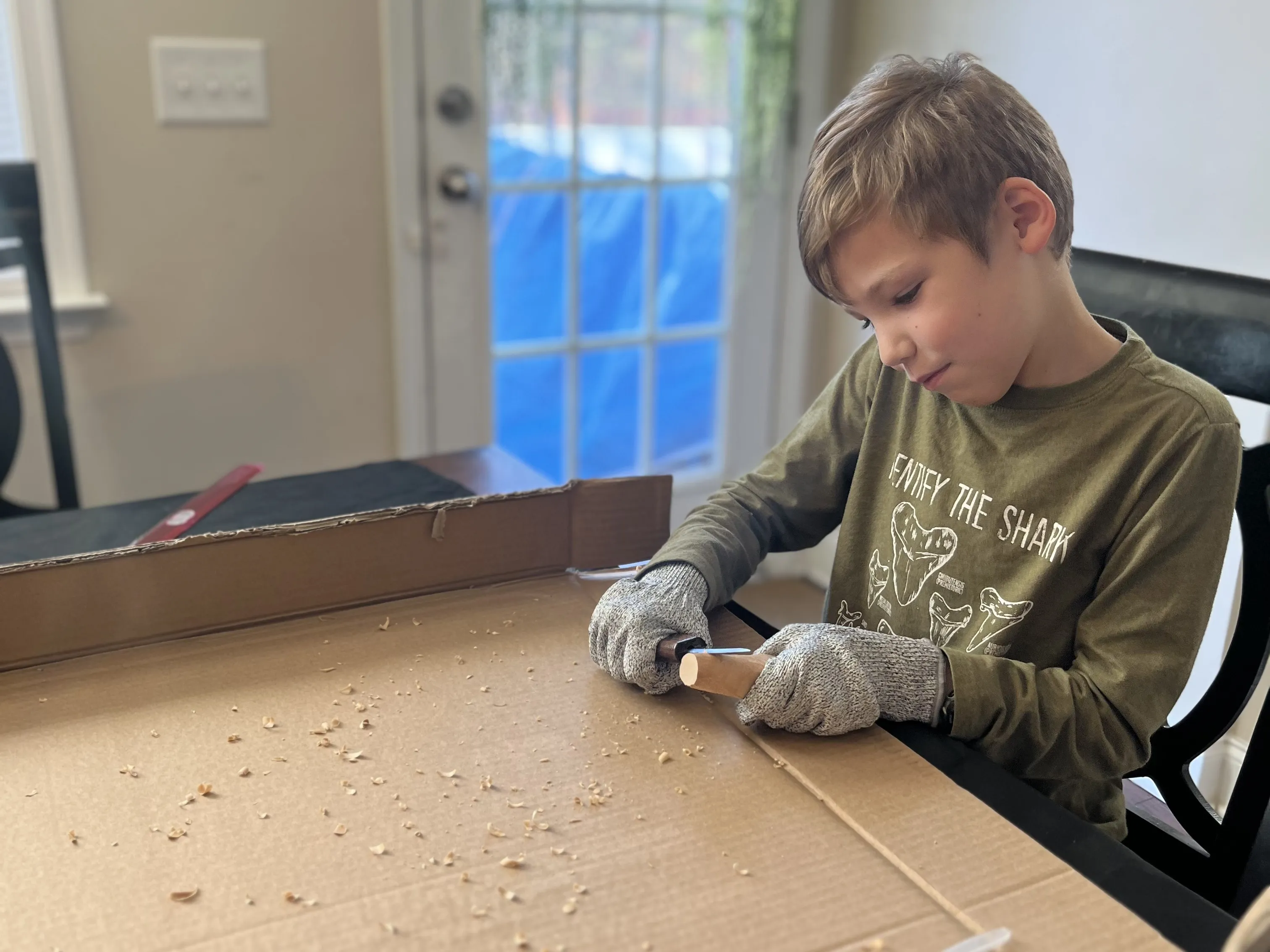 Boy carving wood